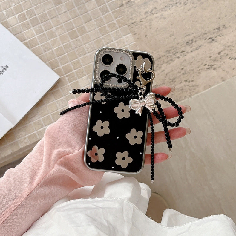 Black Floral iPhone Case with Silver Bow Charm – Elegant Glossy Protective Cover