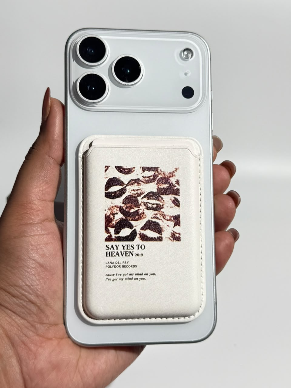 Say Yes to Heaven ivory MagSafe wallet with lips collage on iPhone