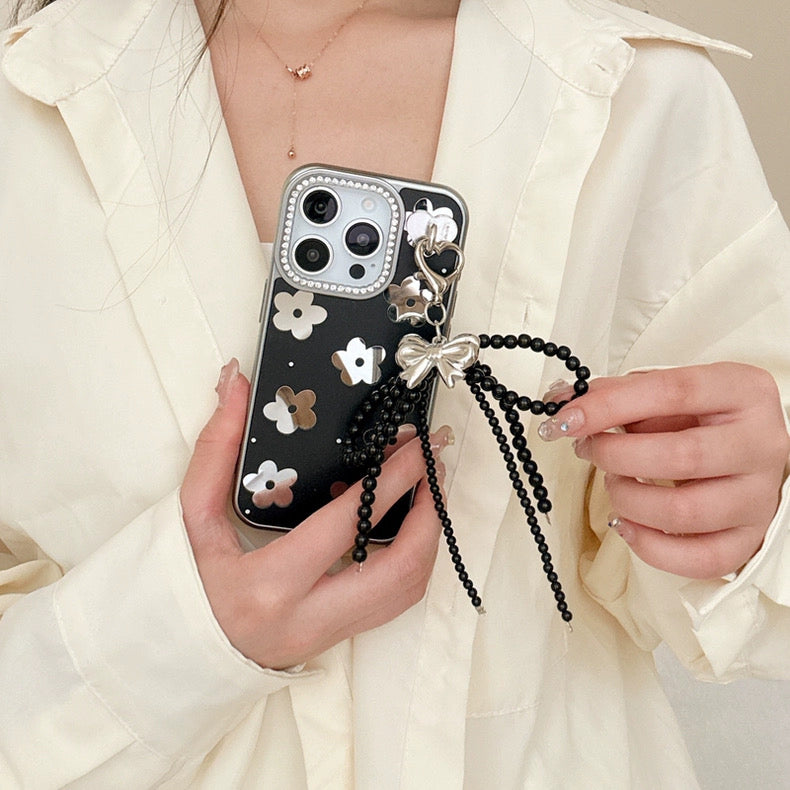 Black Floral iPhone Case with Silver Bow Charm – Elegant Glossy Protective Cover