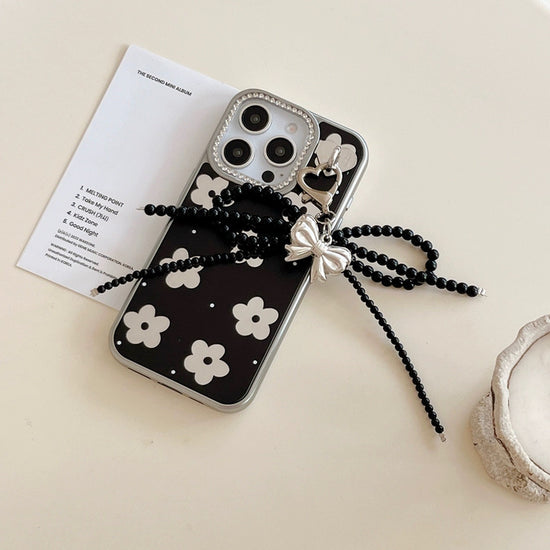 Black Floral iPhone Case with Silver Bow Charm – Elegant Glossy Protective Cover