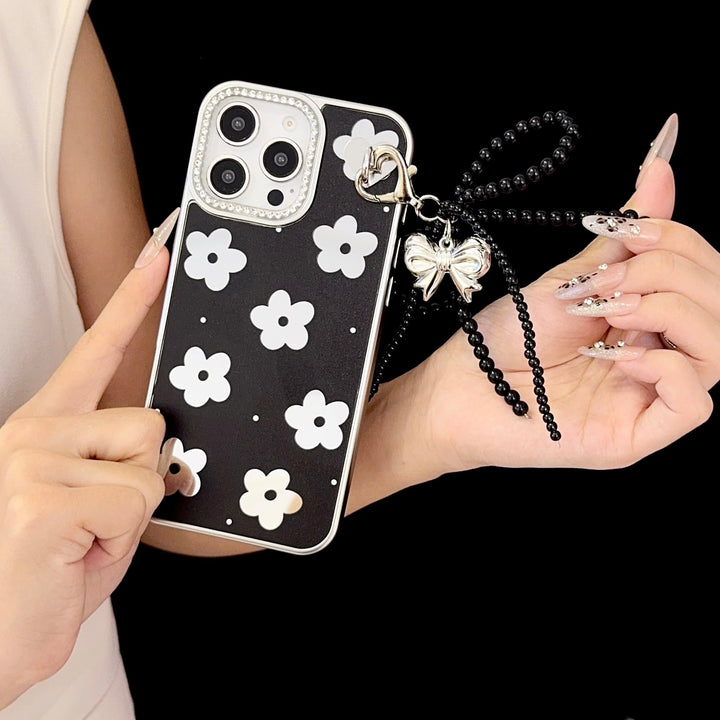Black Floral iPhone Case with Silver Bow Charm – Elegant Glossy Protective Cover