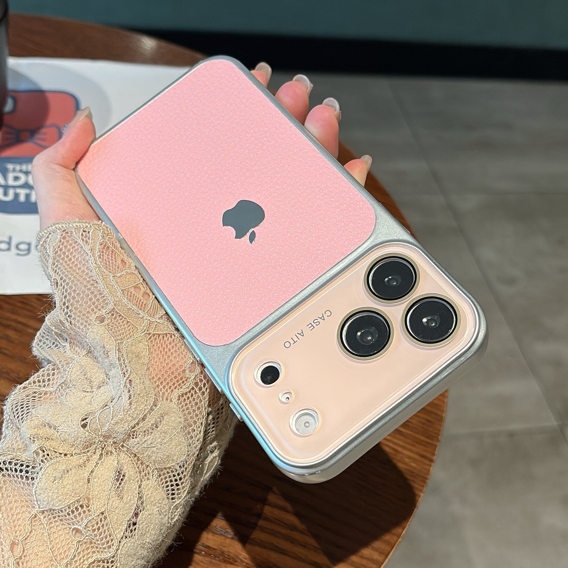 Premium pink leather-textured phone case showing camera guard detail