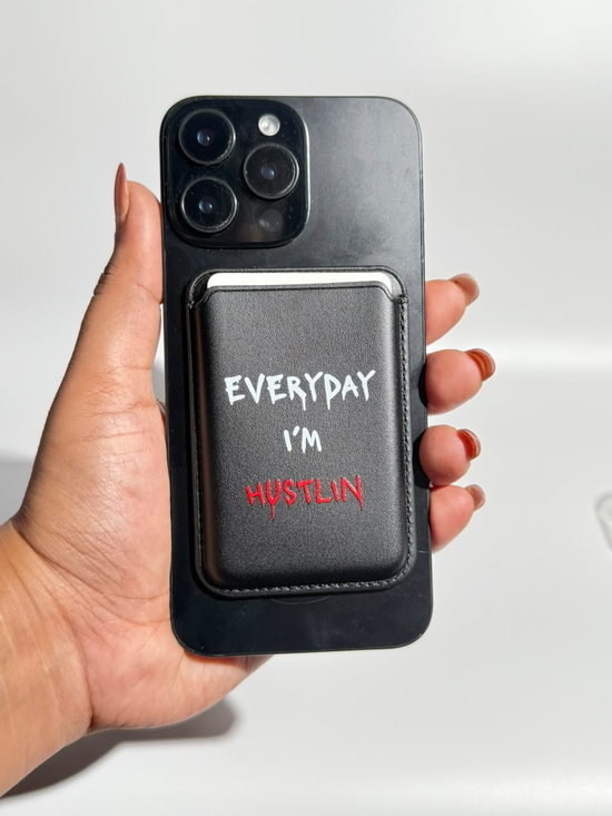 Black Everyday I'm Hustlin MagSafe wallet on iPhone