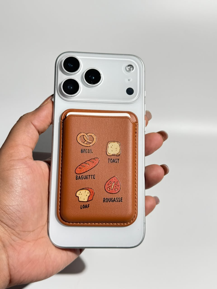 Brown bakery print MagSafe wallet on iPhone