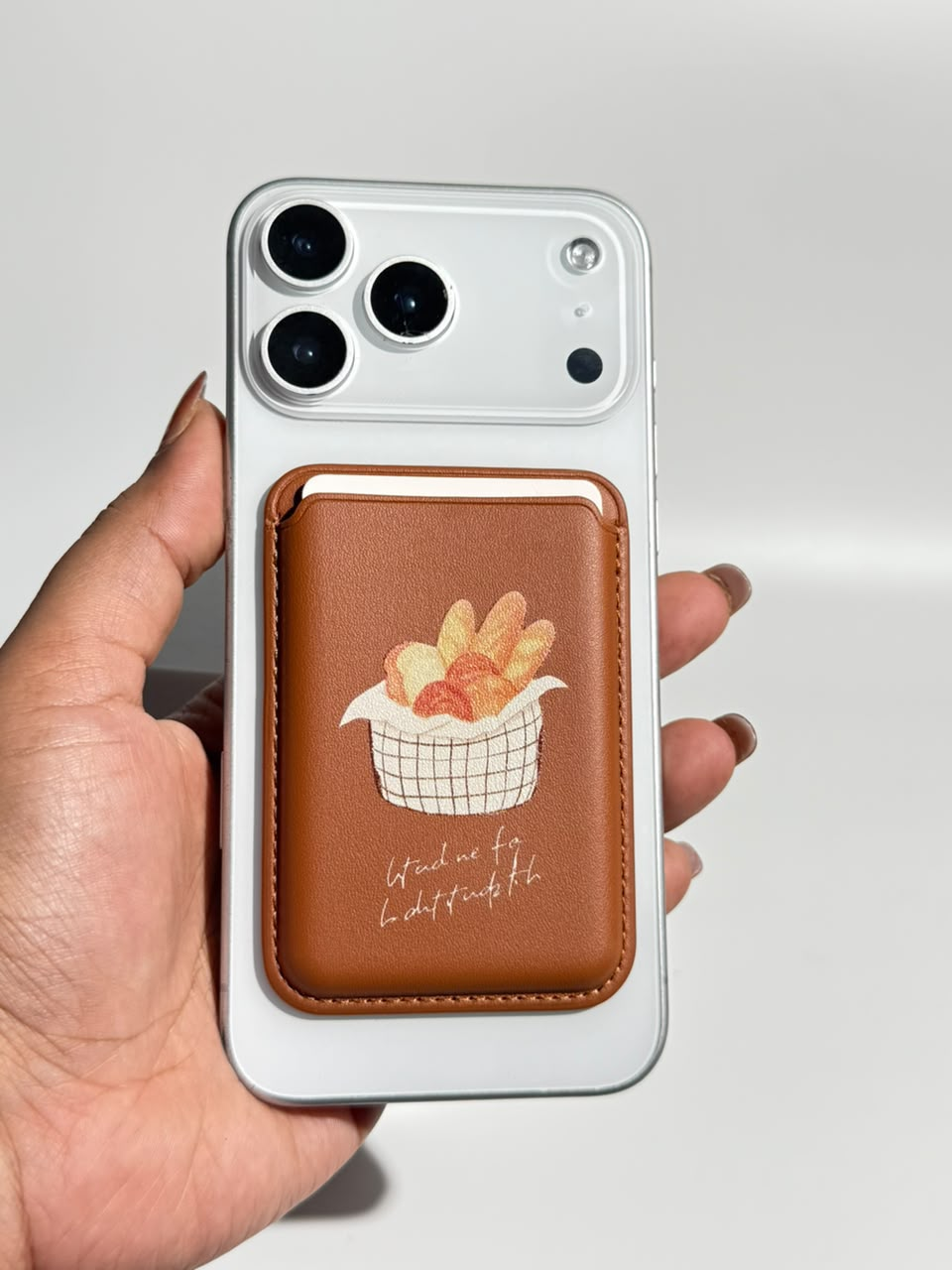 Caramel brown bread basket MagSafe wallet on iPhone