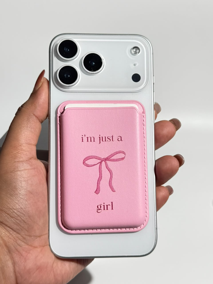 Pink I'm Just a Girl bow MagSafe wallet on iPhone