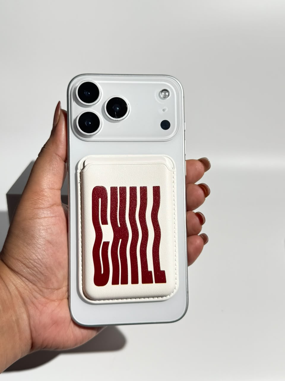 Burgundy Chill ivory MagSafe wallet on iPhone